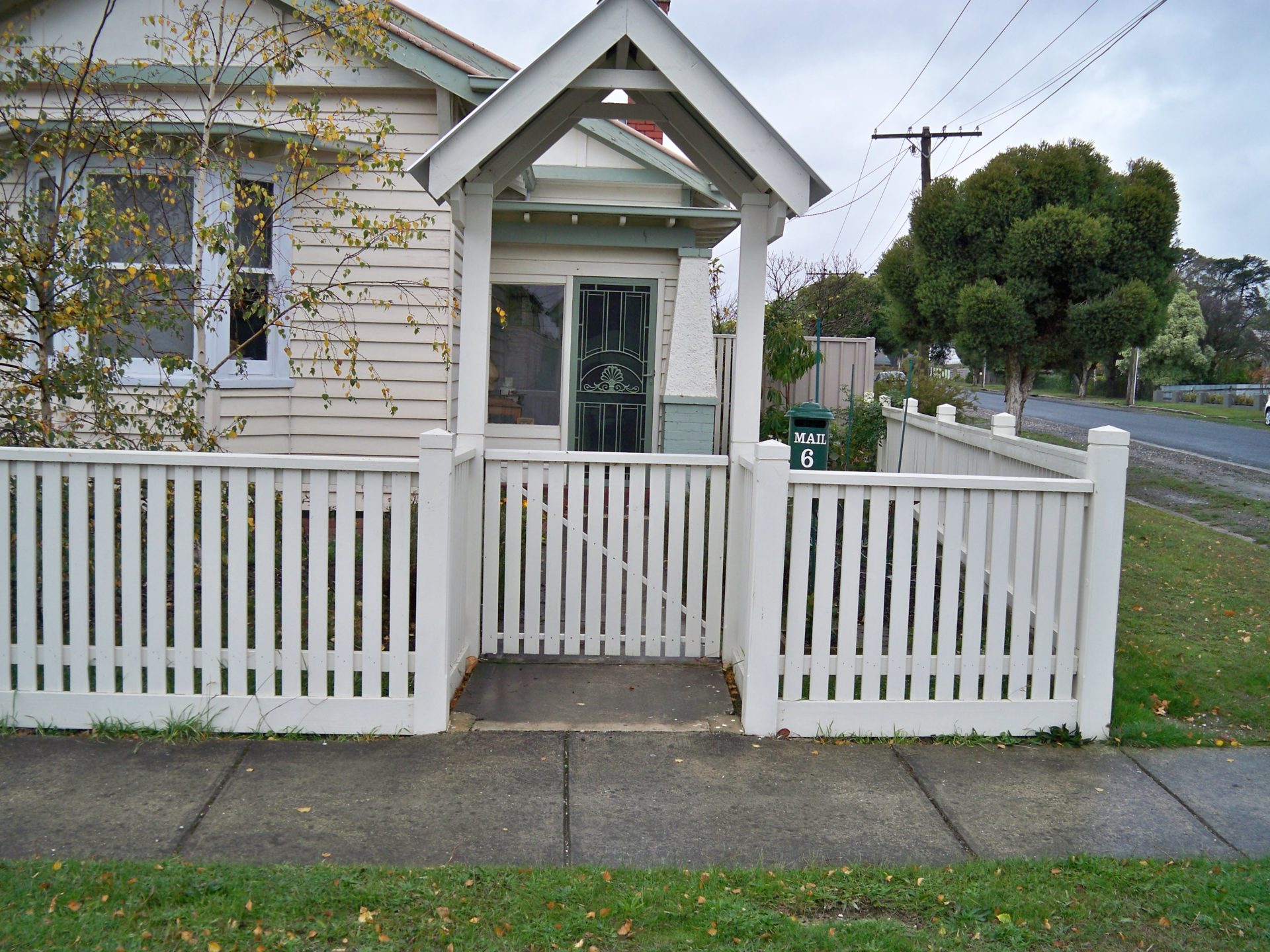 Timber Picket Fence With Capping, Exposed Post With Shaped Tops